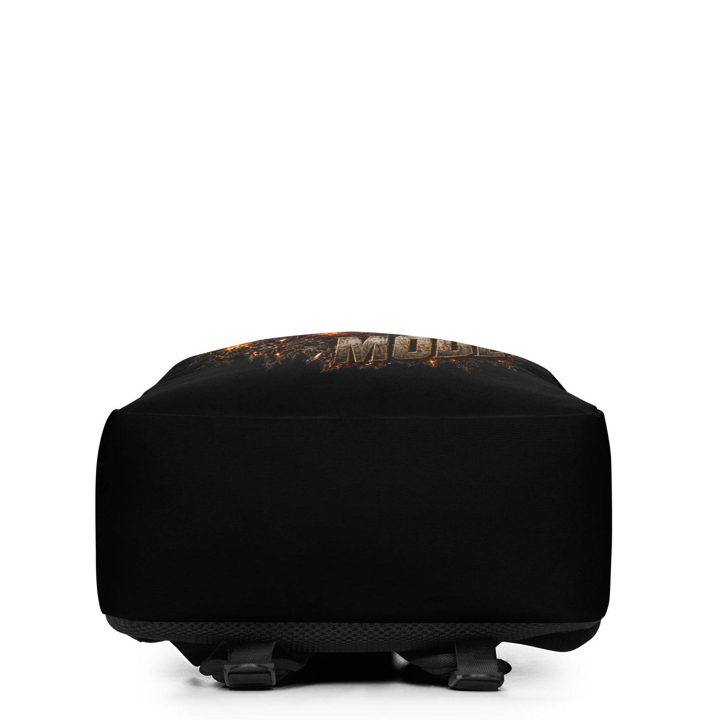 A black minimalist backpack displayed at an angle on a plain white background, featuring an explosive, fiery graphic of a steam locomotive charging forward, framed by the text BEAST at the top and MODE at the bottom in rugged, stone-textured letters.
