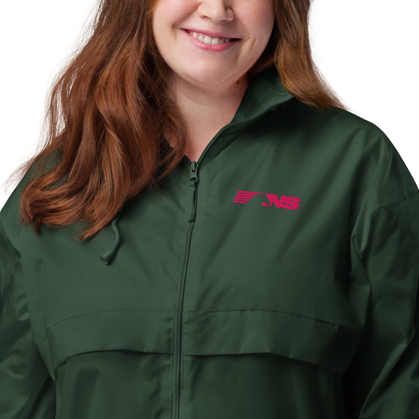 A person wearing a black windbreaker with 'NS Rail' pink embroidered on the chest.