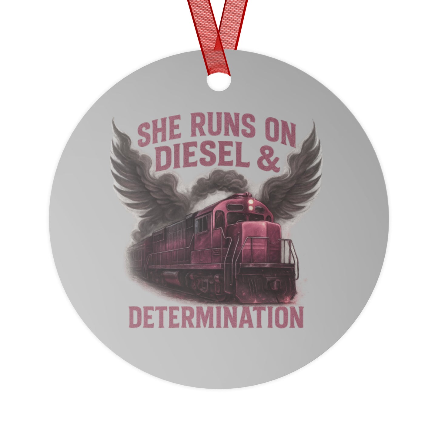 Circular ornament with train design and text 'She runs on diesel & determination' on a white background.