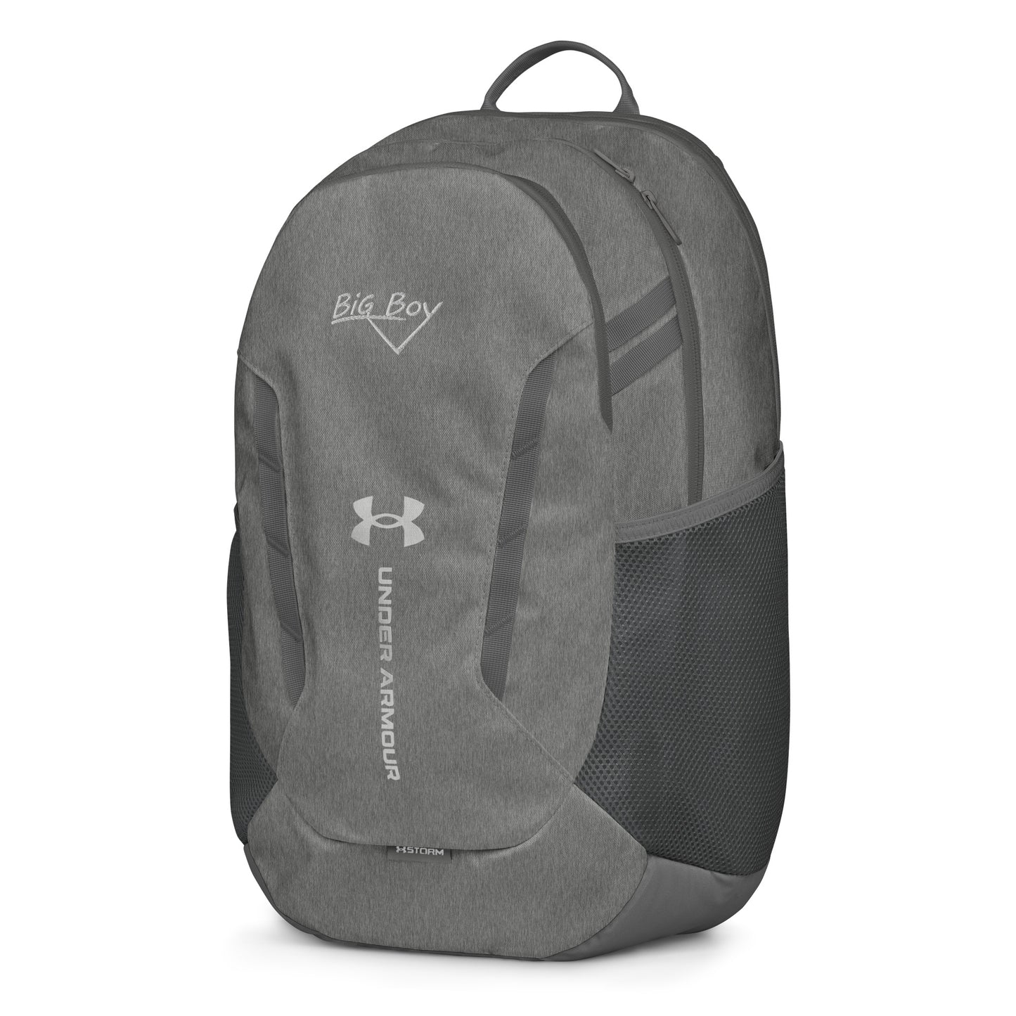 Gray Under Armour backpack featuring the classic white chalk-style "Big Boy" script logo on the top front panel. A silver Under Armour logo is centered above the vertical text "UNDER ARMOUR". The bottom of the bag features the UA Storm technology badge.