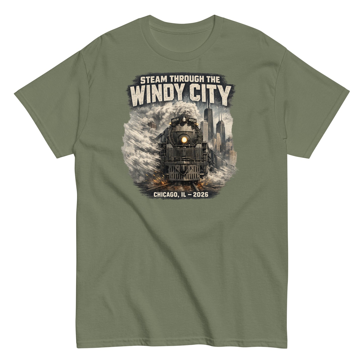 Army green t-shirt featuring a graphic of a steam locomotive emerging from smoke in front of a city skyline, with text reading "STEAM THROUGH THE WINDY CITY" at the top and "CHICAGO, IL - 2026" at the bottom.