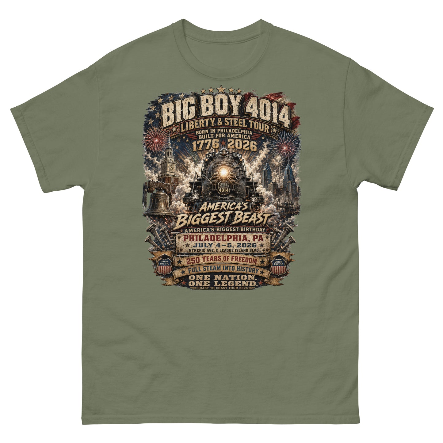 Army green t-shirt featuring a highly detailed graphic of the Big Boy 4014 steam locomotive, Liberty Bell, Independence Hall, and Philadelphia skyline with fireworks. Text reads "BIG BOY 4014", "LIBERTY & STEEL TOUR", "BORN IN PHILADELPHIA BUILT FOR AMERICA", "1776 - 2026", "AMERICA'S BIGGEST BEAST", "AMERICA'S BIGGEST BIRTHDAY", "PHILADELPHIA, PA JULY 4-5, 2026", "250 YEARS OF FREEDOM", "FULL STEAM INTO HISTORY", and "ONE NATION. ONE LEGEND."