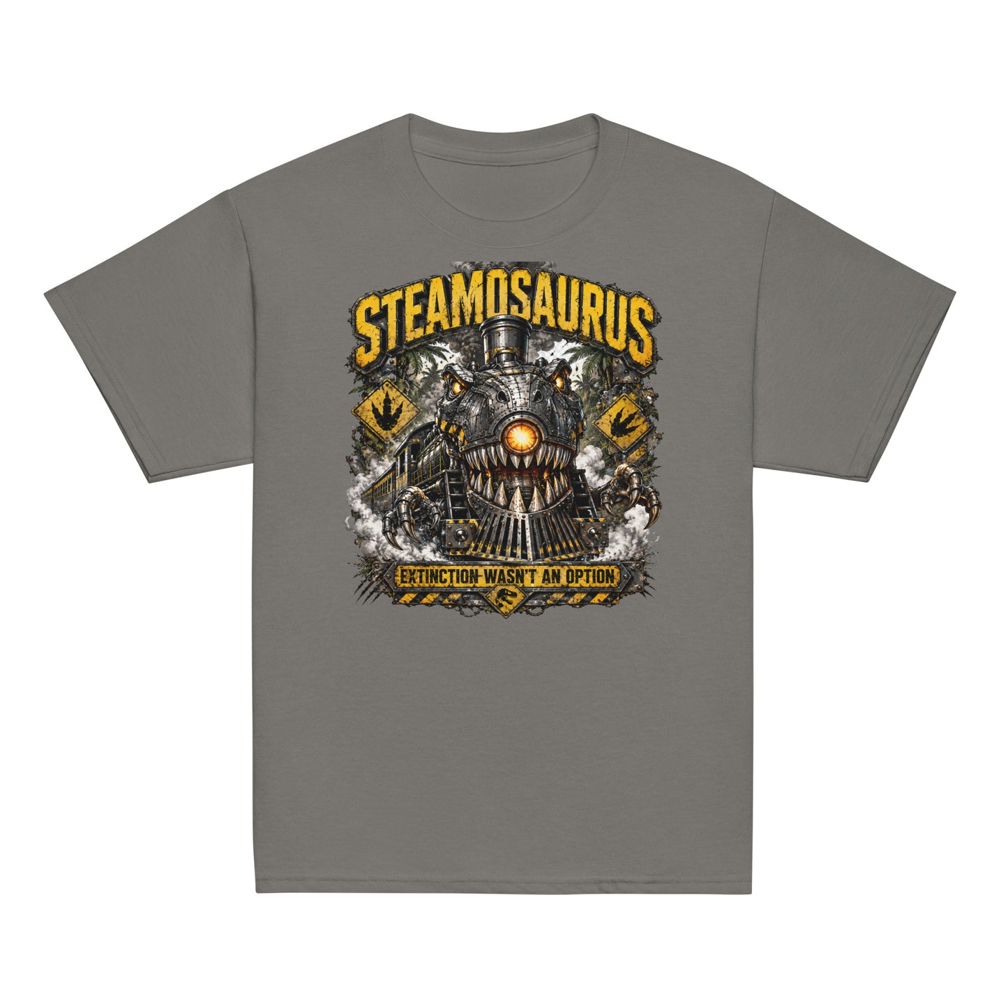 Youth gray t-shirt featuring a graphic that combines a T-Rex dinosaur and a steam locomotive. The monster train has metal teeth, mechanical claws, and a glowing orange headlight. Yellow distressed text reads "STEAMOSAURUS" at the top and "EXTINCTION WASN'T AN OPTION" on a hazard banner at the bottom. The background includes jungle trees and yellow dinosaur footprint caution signs.