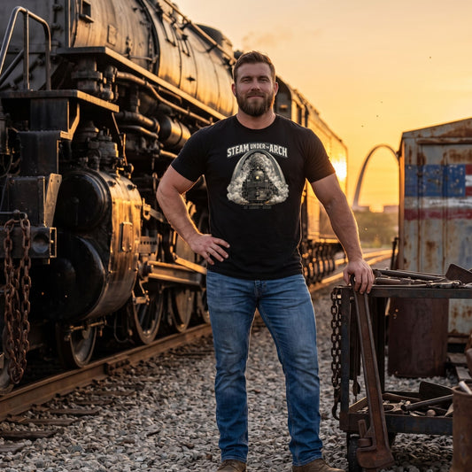 Black t-shirt featuring the Big Boy 4014 steam locomotive under the St. Louis Gateway Arch, with text reading "Steam Under The Arch" and "St. Louis - 2026".