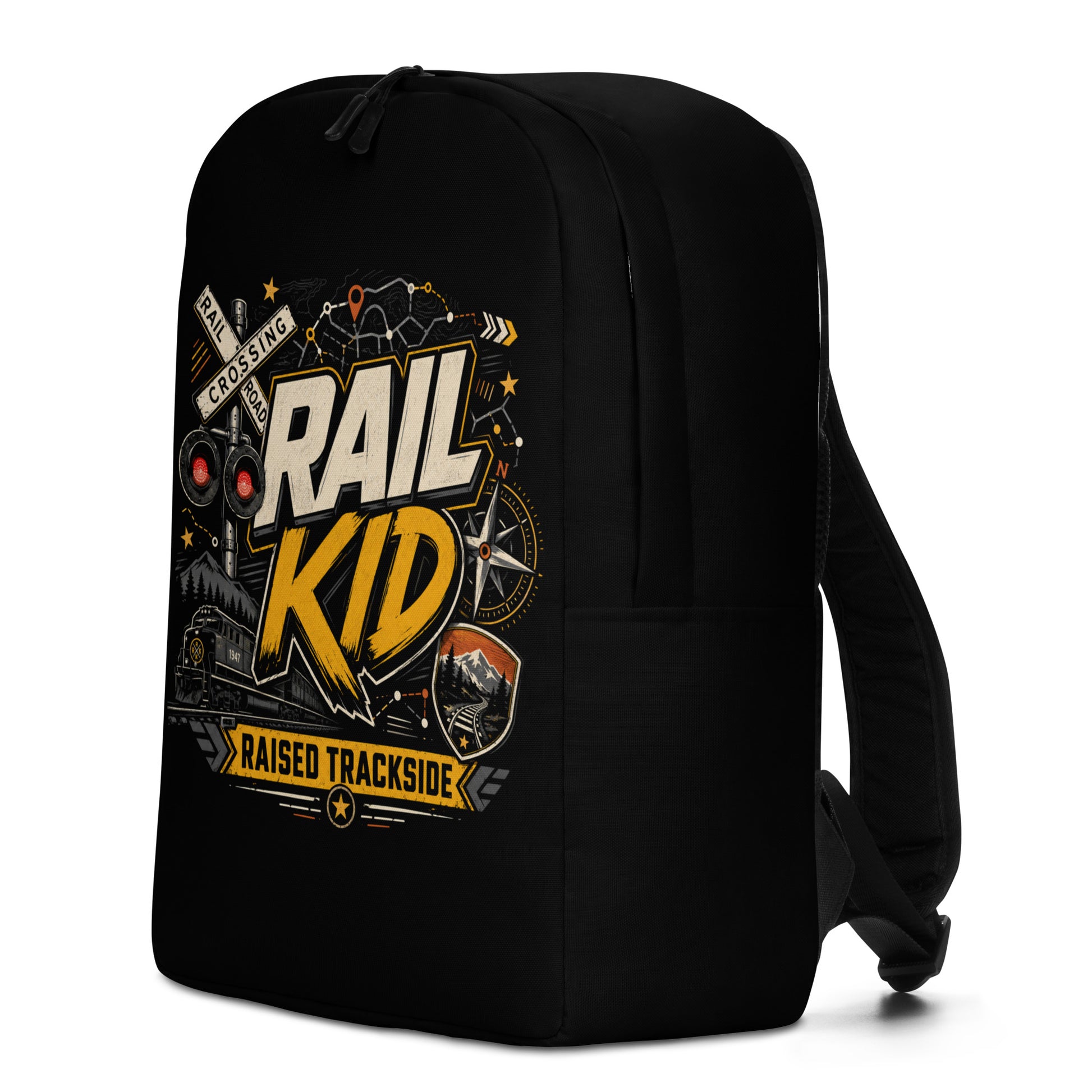 Black minimalist backpack featuring a colorful graphic design. The main text reads "RAIL KID" in large, bold letters, with a yellow banner underneath reading "RAISED TRACKSIDE". The design includes a railroad crossing signal with glowing red lights, a compass, a diesel locomotive train, and a mountain track badge on a dark background.