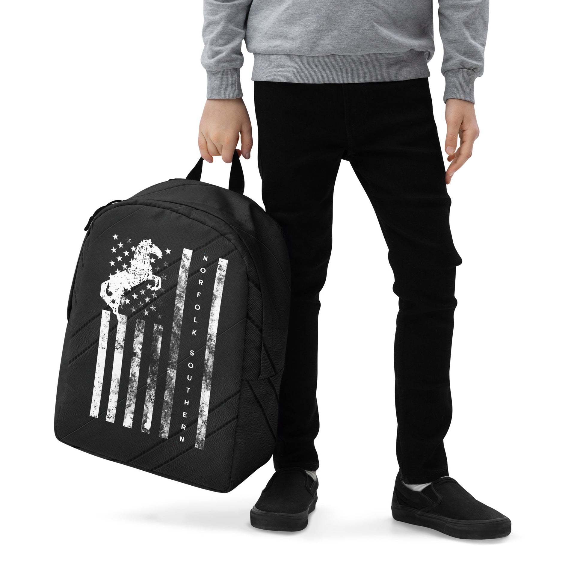 Person holding a black backpack with a design on a white background