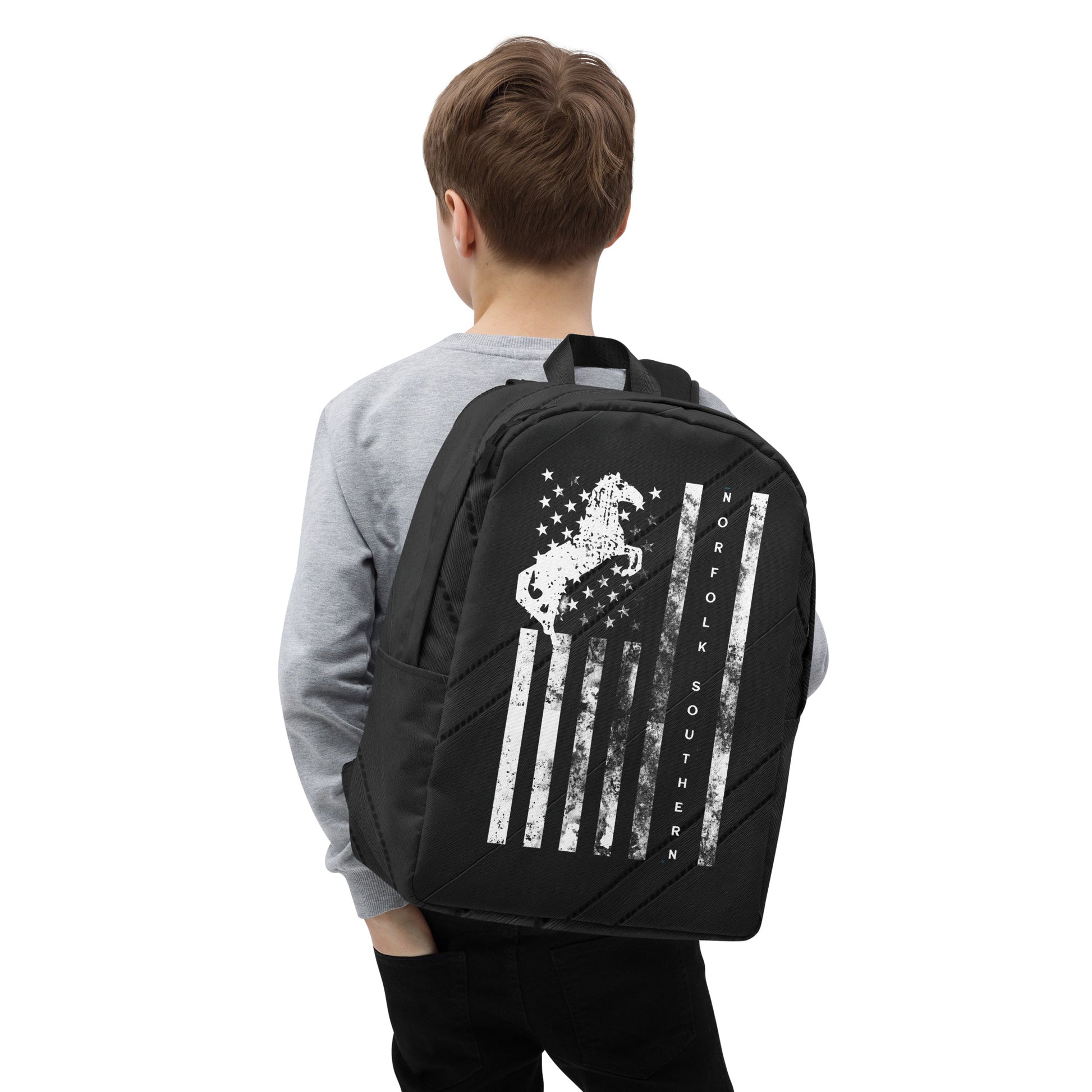Person wearing a black backpack with a design on the back