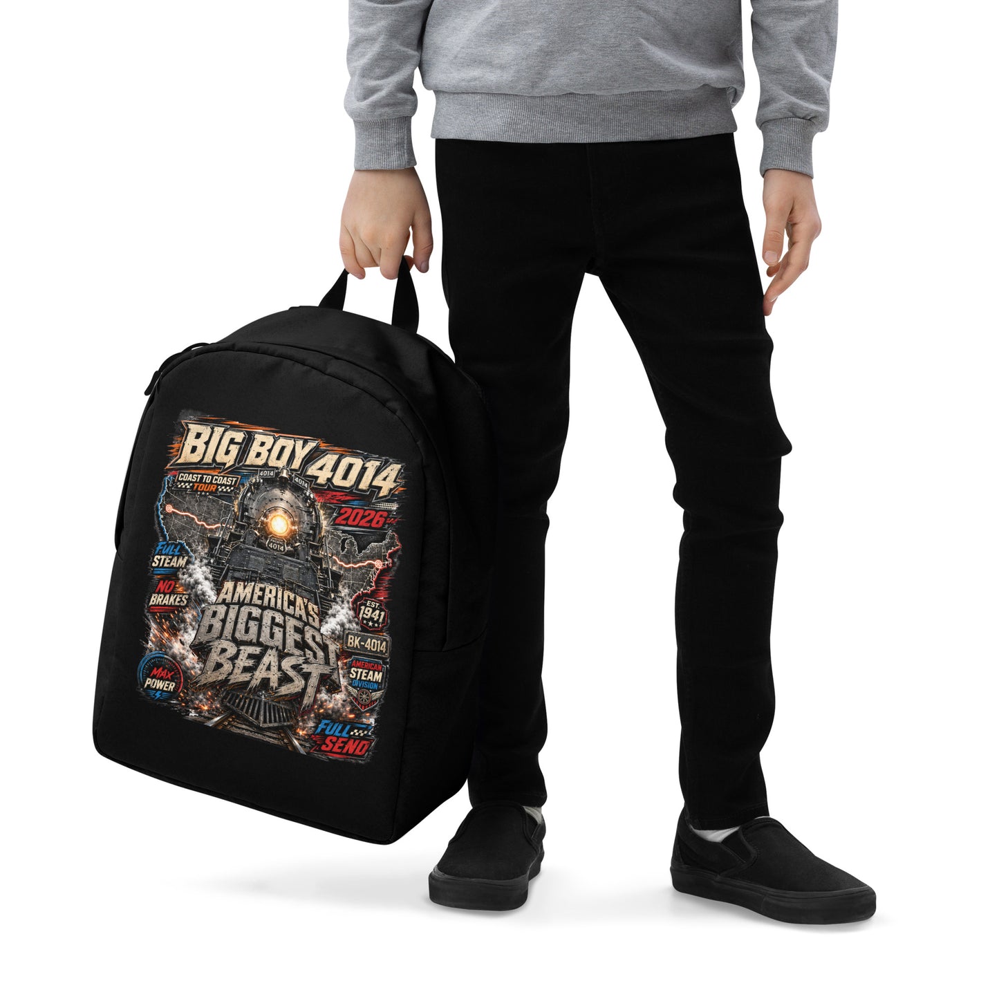 Black minimalist backpack featuring a high-energy, colorful graphic of the Big Boy 4014 steam locomotive backed by a US map, with bold text reading "BIG BOY 4014", "COAST TO COAST TOUR 2026", "AMERICA'S BIGGEST BEAST", "FULL STEAM", "NO BRAKES", "MAX POWER", and "FULL SEND".
