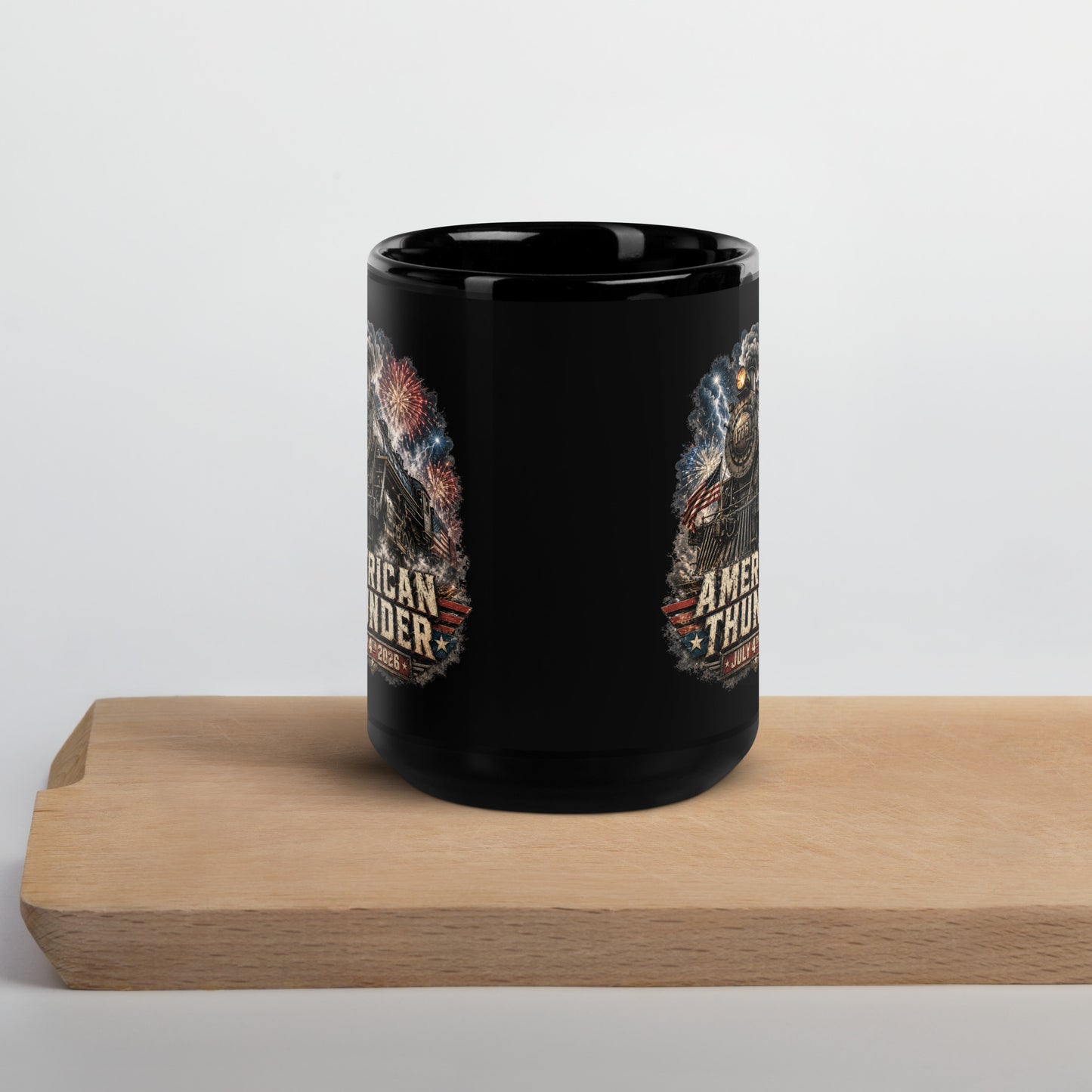 Black 15-ounce glossy coffee mug featuring a 1776 steam locomotive charging through smoke and patriotic fireworks, with an American flag and distressed text reading "AMERICAN THUNDER" over a red, white, and blue banner, followed by "JULY 4TH 2026".