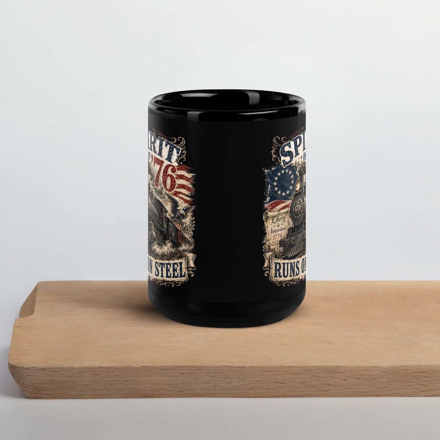 Black 15-ounce glossy coffee mug featuring a highly detailed vintage graphic. Distressed text reads "THE SPIRIT OF '76". The center shows a classic steam locomotive with "1776" on the front plate, bursting from a 13-star Betsy Ross American flag. A bald eagle flies on the right, and a parchment scroll on the left reads "Liberty & Independence 1776". A banner at the bottom reads "RUNS ON STEEL".
