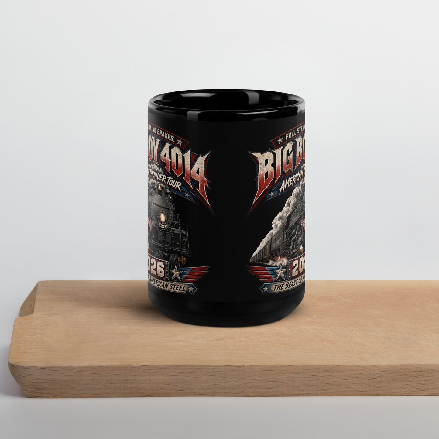 Black 15-ounce glossy coffee mug featuring a dynamic graphic of the Big Boy 4014 steam locomotive charging forward with billowing smoke and an American flag on the front. Bold text reads "FULL STEAM. NO BRAKES.", "BIG BOY 4014", "AMERICAN THUNDER TOUR", "2026", and "THE BEAST OF AMERICAN STEEL".