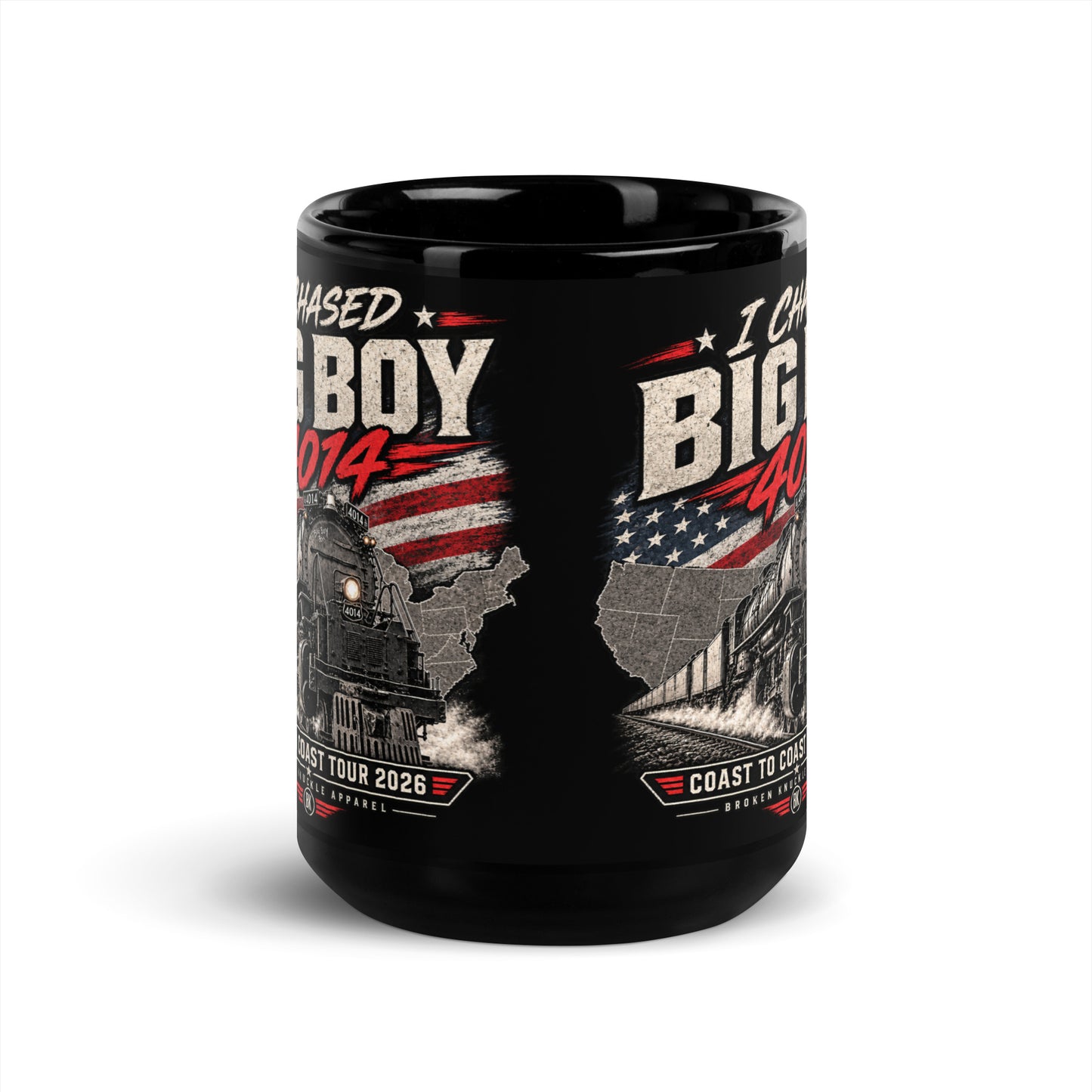 Black glossy 15 oz ceramic mug featuring a graphic of the Big Boy 4014 steam locomotive charging out of a USA map filled with the American flag. Distressed text reads "I CHASED BIG BOY 4014" at the top and "COAST TO COAST TOUR 2026" on a banner at the bottom above the Broken Knuckle Apparel logo.