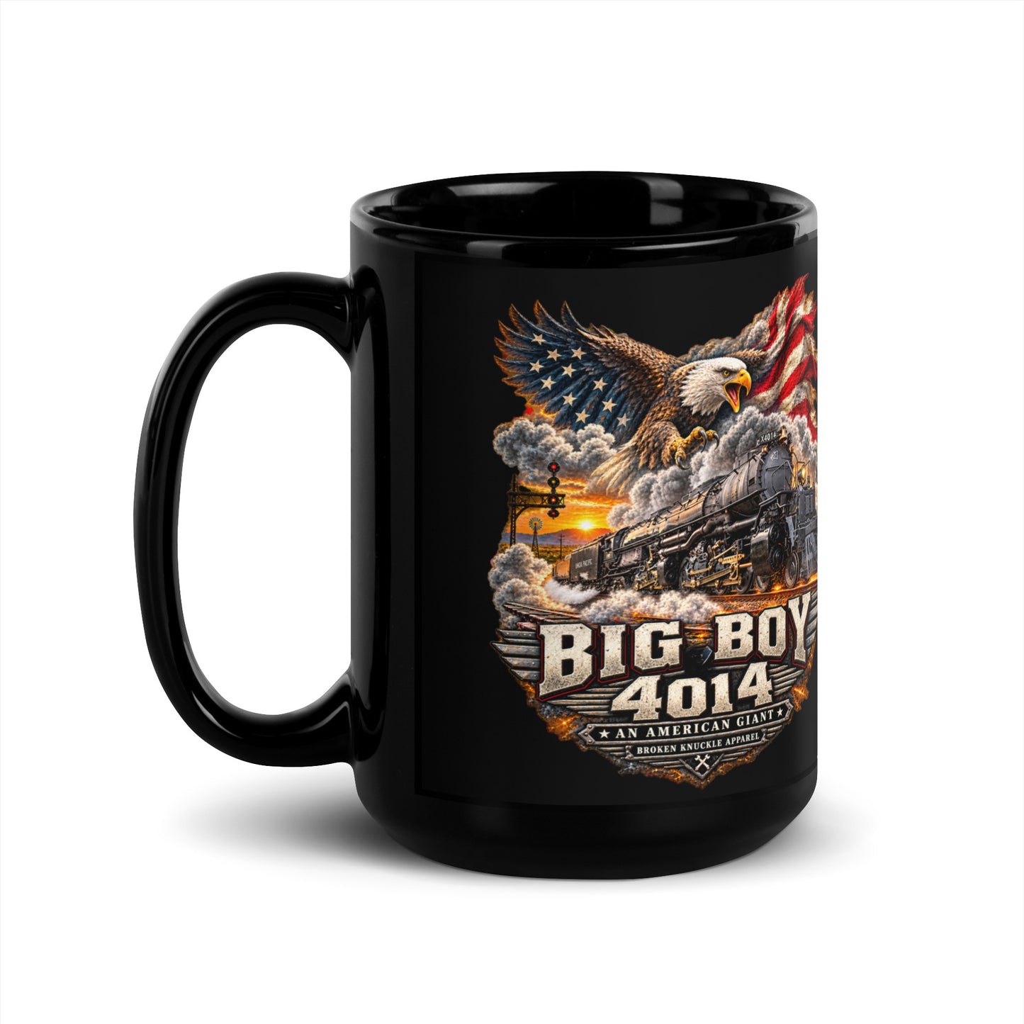 Black glossy 15 oz ceramic mug featuring a highly detailed patriotic graphic. A bald eagle and American flag soar above the Big Boy 4014 steam locomotive charging down the tracks at sunset. Bold metallic-style text reads "BIG BOY 4014" above a banner reading "AN AMERICAN GIANT" and the Broken Knuckle Apparel logo.