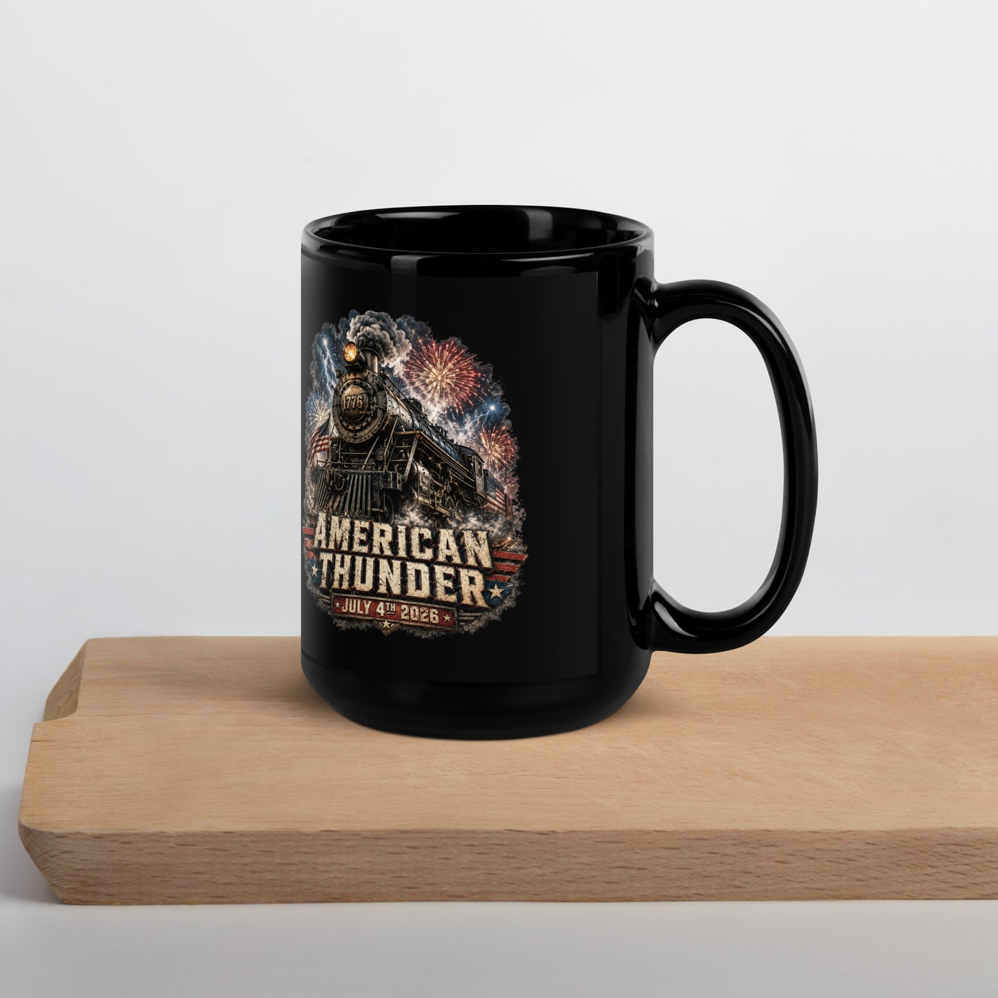 Black 15-ounce glossy coffee mug featuring a 1776 steam locomotive charging through smoke and patriotic fireworks, with an American flag and distressed text reading "AMERICAN THUNDER" over a red, white, and blue banner, followed by "JULY 4TH 2026".