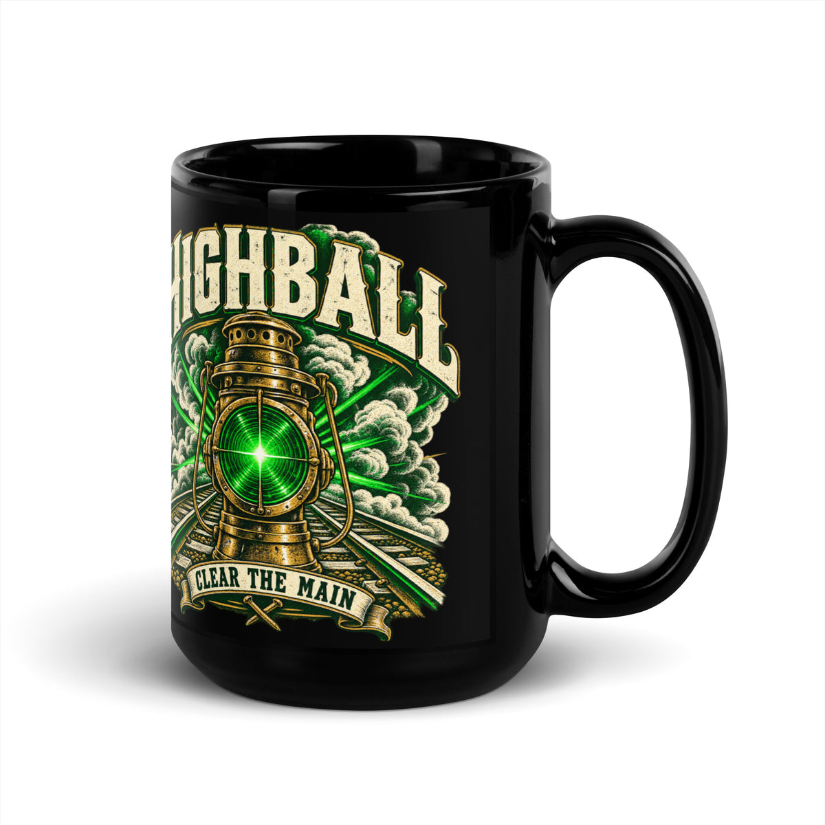 Black glossy 15 oz ceramic mug featuring a vintage brass railroad lantern shining a bright green light over train tracks surrounded by steam. Large distressed text arched at the top reads "HIGHBALL". A banner at the bottom reads "CLEAR THE MAIN" above crossed railroad spikes.   
