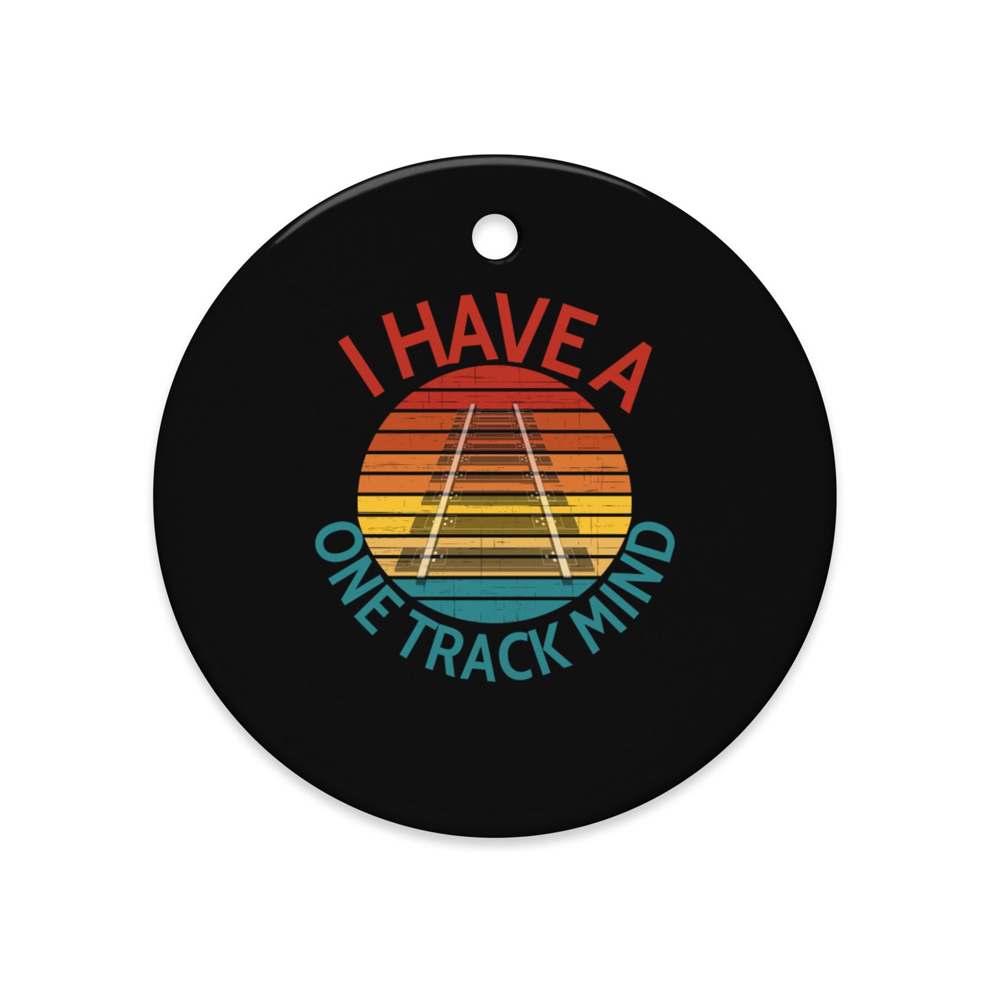 Round black ceramic ornament with colorful design and text 'I Have a One Track Mind' on a white background