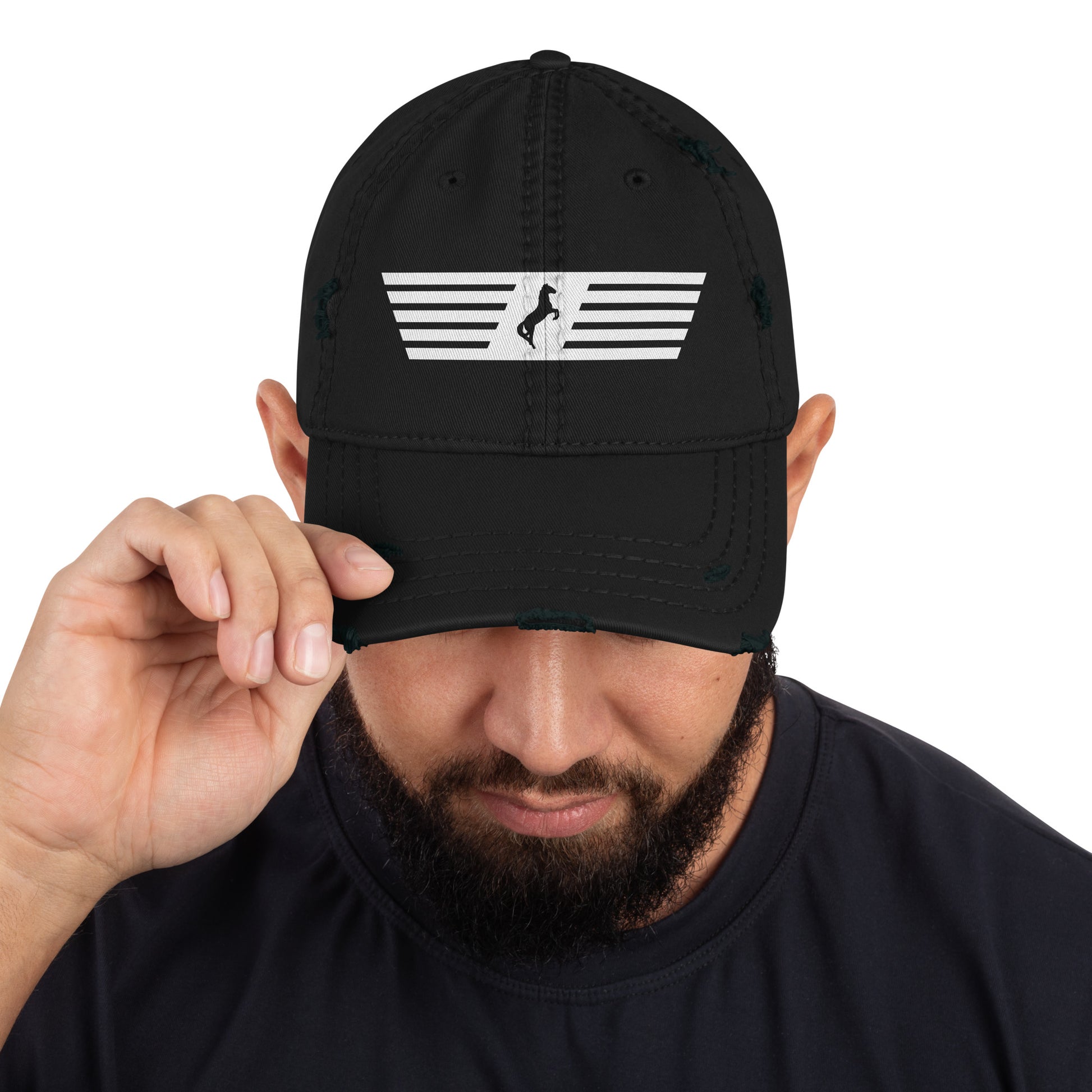 Person wearing a black cap with a white logo on a white background