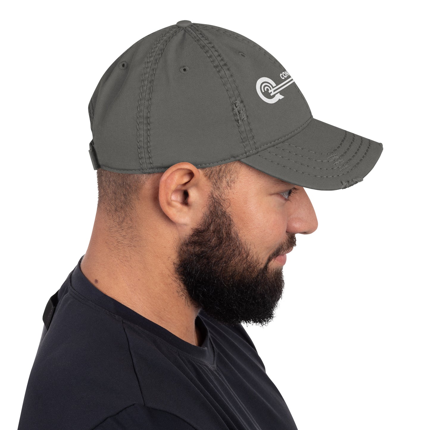 Man wearing a gray cap with a logo on a white background