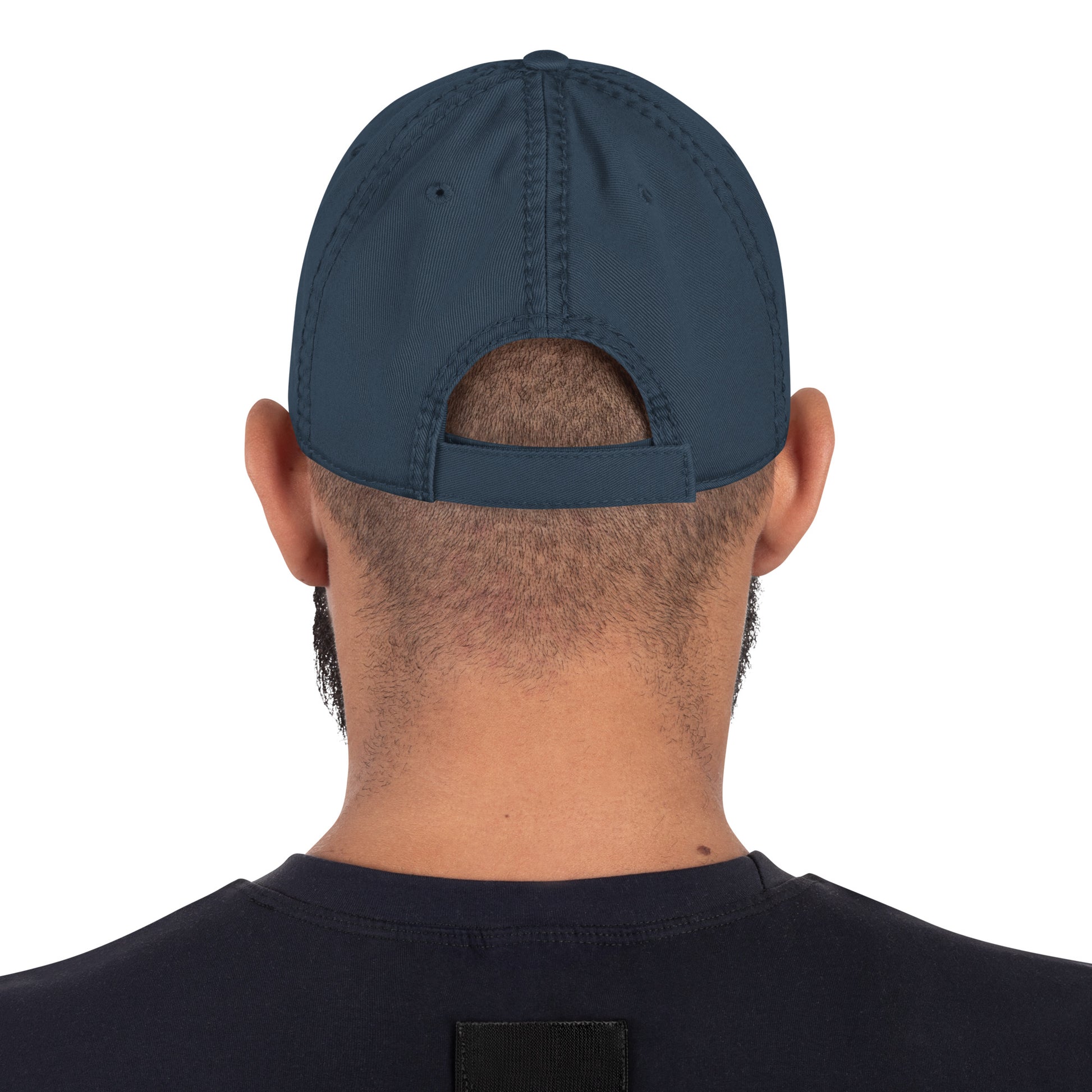 Person wearing a navy blue cap from behind on a white background