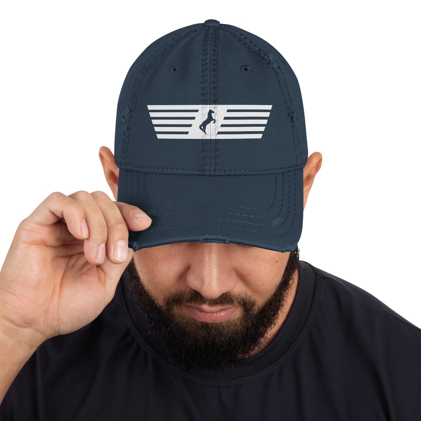 Man holding a navy blue cap with a white logo on a white background