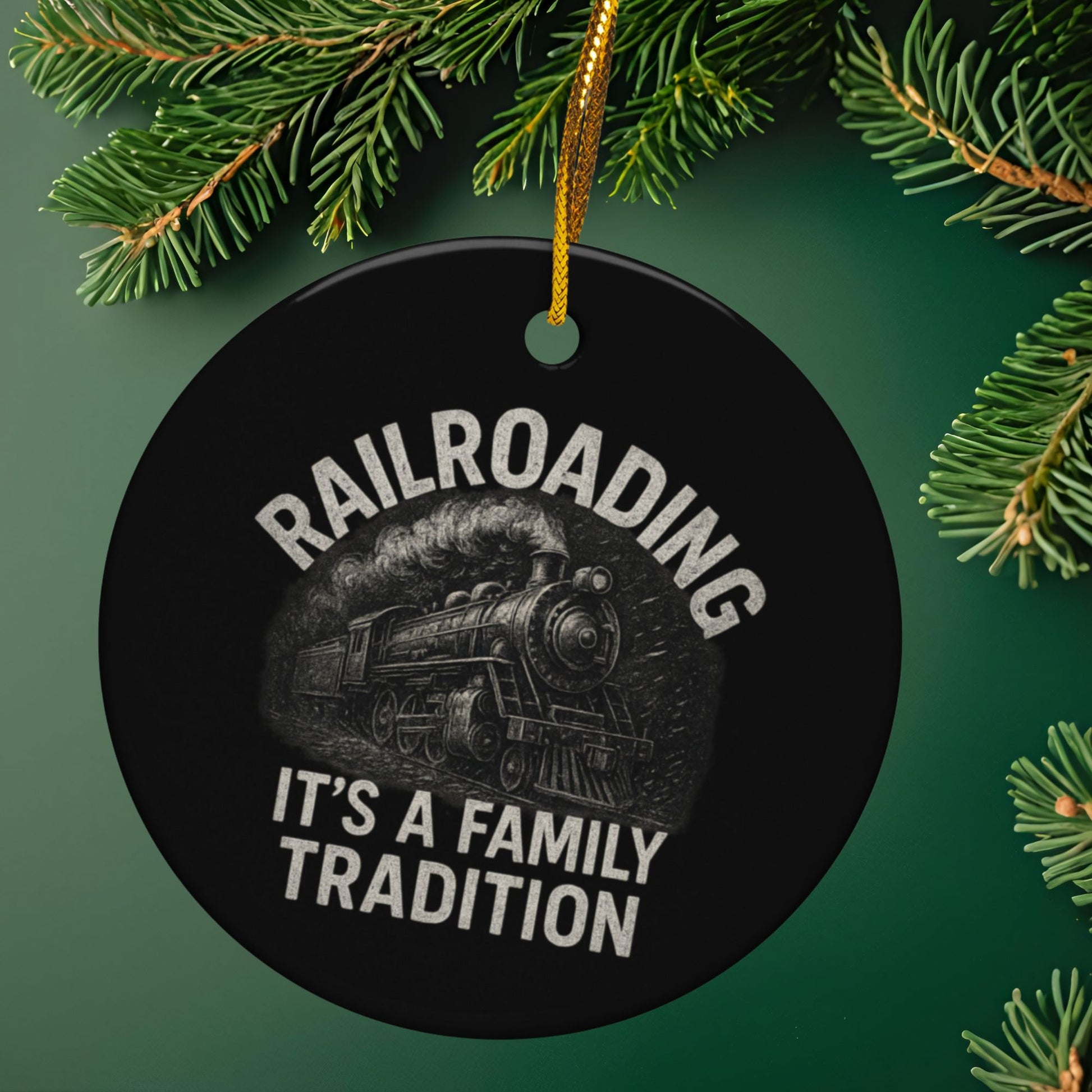 Round black ornament with train design and text 'Railroading It's a Family Tradition' on a green background with Christmas tree branches.