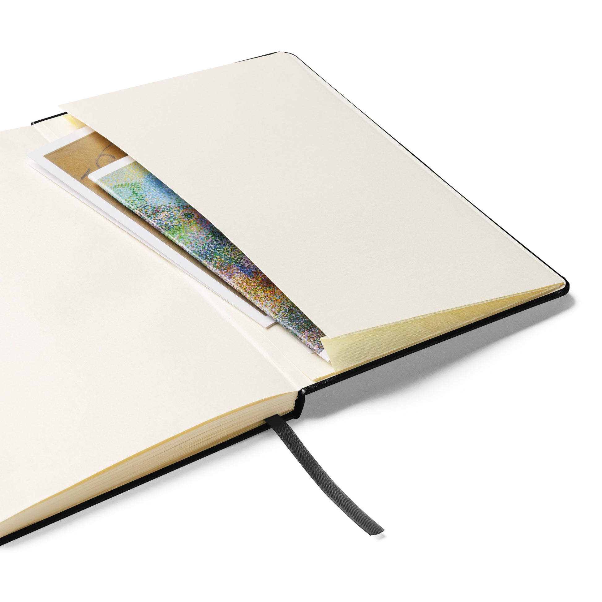 Open notebook with a smartphone inside on a white background