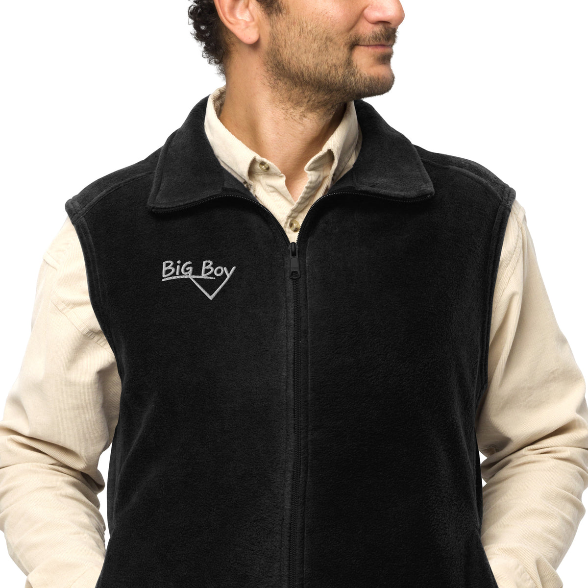 Man wearing a Black Men's Columbia fleece full-zip vest featuring the classic white chalk-style "Big Boy" script logo cleanly embroidered on the right chest.
