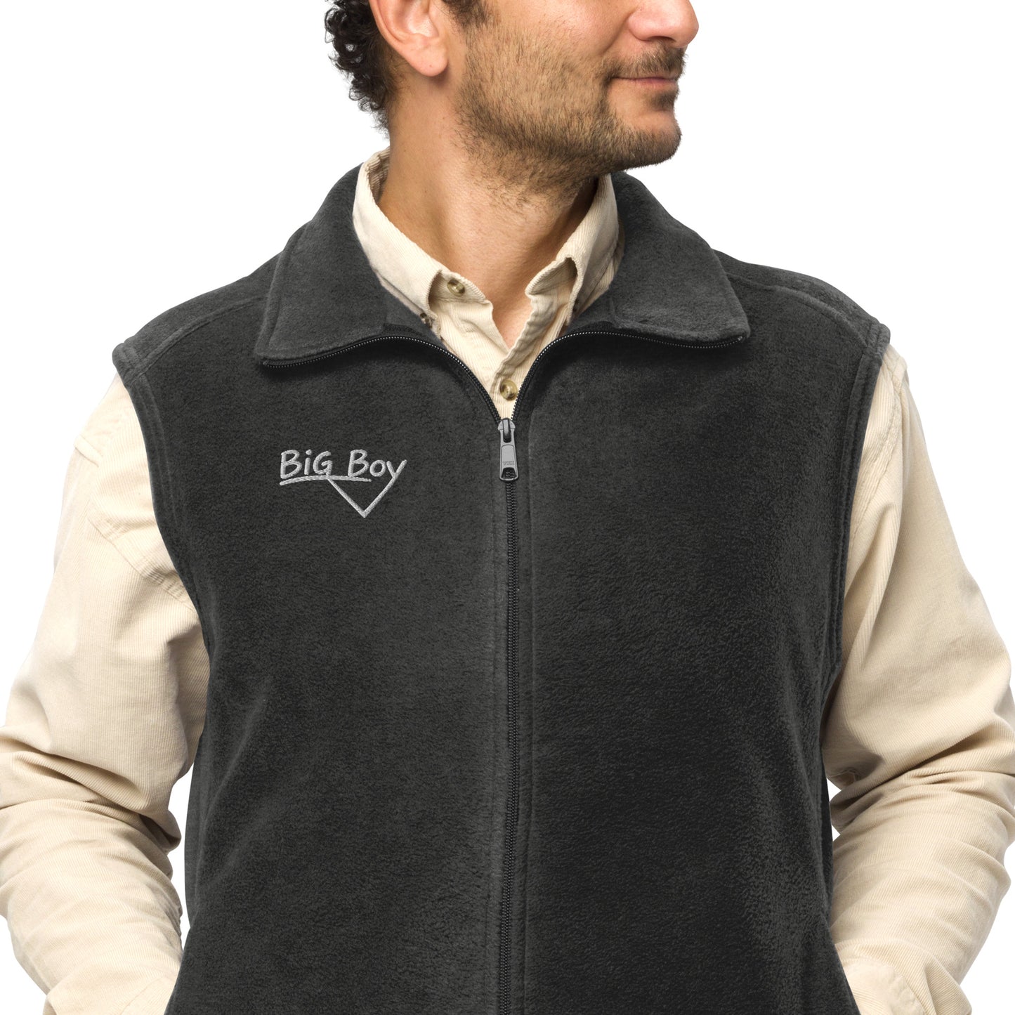 Man wearing a gray Men's Columbia fleece full-zip vest featuring the classic white chalk-style "Big Boy" script logo cleanly embroidered on the right chest.