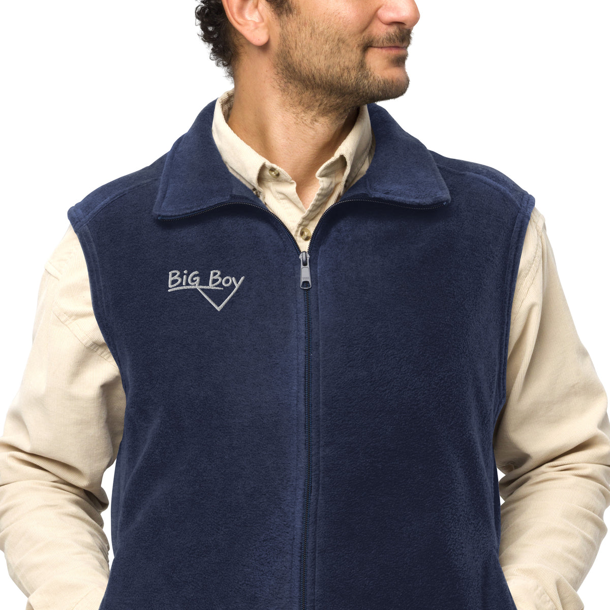 Man wearing a navy Men's Columbia fleece full-zip vest featuring the classic white chalk-style "Big Boy" script logo cleanly embroidered on the right chest.