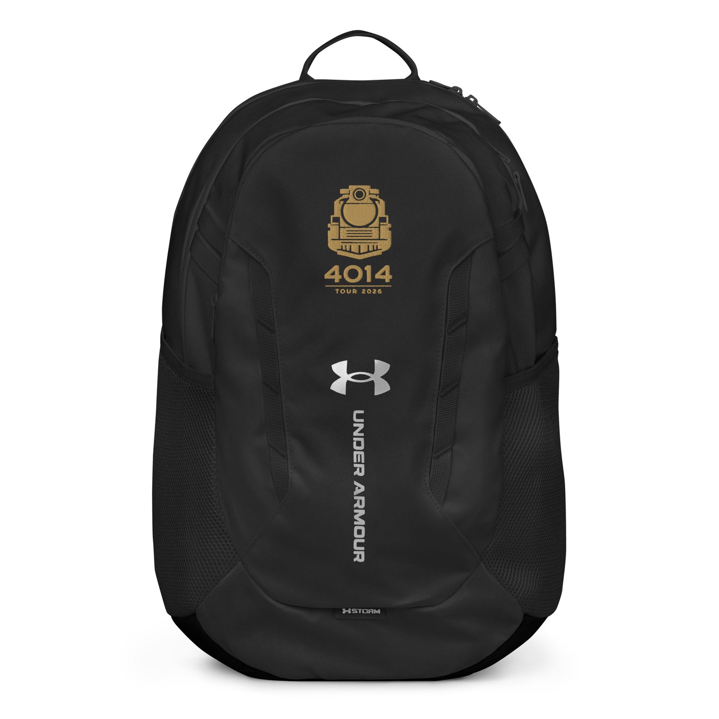 Black Under Armour backpack featuring a gold graphic of a front-facing steam locomotive above the text "4014 TOUR 2026". The silver Under Armour logo is centered on the front above the vertical text "UNDER ARMOUR". The bottom of the bag features the UA Storm technology badge.