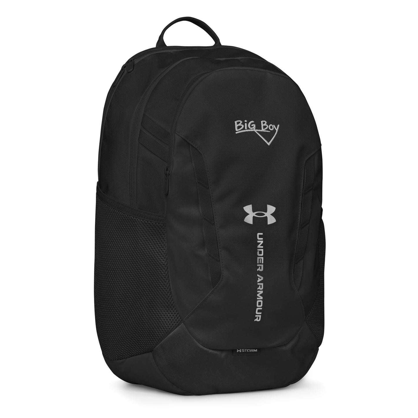 Black Under Armour backpack featuring the classic white chalk-style "Big Boy" script logo on the top front panel. A silver Under Armour logo is centered above the vertical text "UNDER ARMOUR". The bottom of the bag features the UA Storm technology badge.