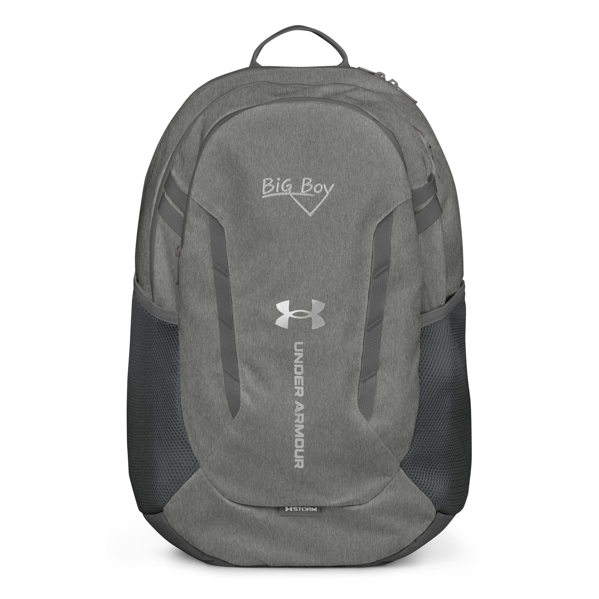 Gray Under Armour backpack featuring the classic white chalk-style "Big Boy" script logo on the top front panel. A silver Under Armour logo is centered above the vertical text "UNDER ARMOUR". The bottom of the bag features the UA Storm technology badge.