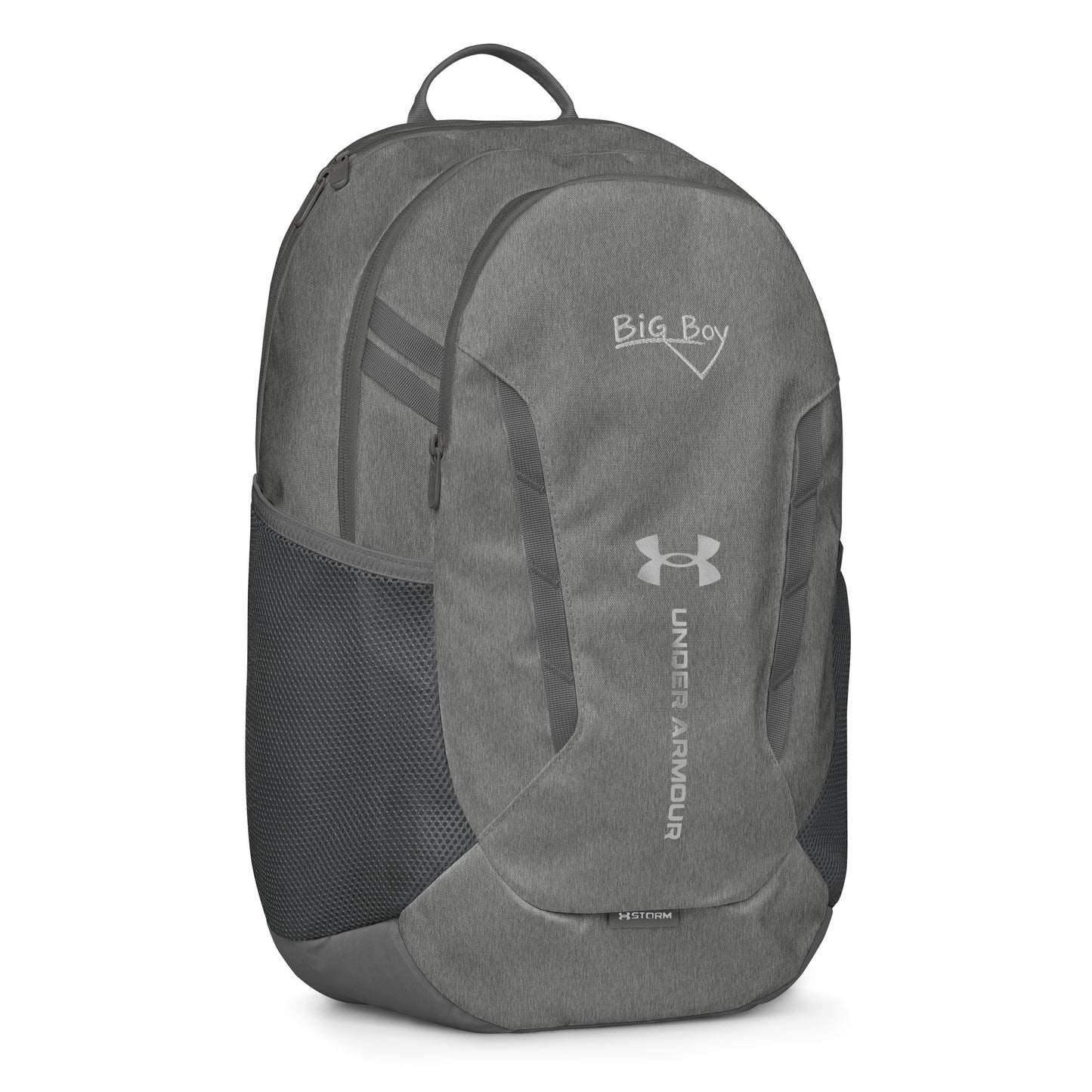 Gray Under Armour backpack featuring the classic white chalk-style "Big Boy" script logo on the top front panel. A silver Under Armour logo is centered above the vertical text "UNDER ARMOUR". The bottom of the bag features the UA Storm technology badge.
