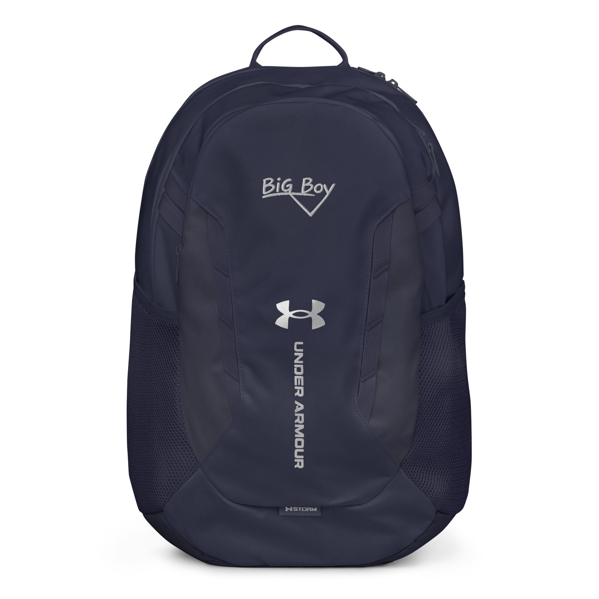 Navy Under Armour backpack featuring the classic white chalk-style "Big Boy" script logo on the top front panel. A silver Under Armour logo is centered above the vertical text "UNDER ARMOUR". The bottom of the bag features the UA Storm technology badge.