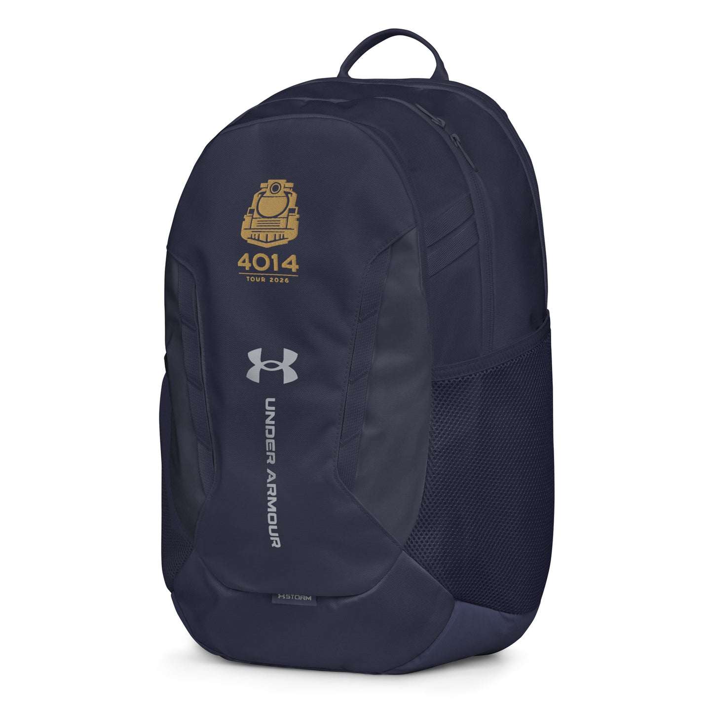 Navy Under Armour backpack featuring a gold graphic of a front-facing steam locomotive above the text "4014 TOUR 2026". The silver Under Armour logo is centered on the front above the vertical text "UNDER ARMOUR". The bottom of the bag features the UA Storm technology badge.