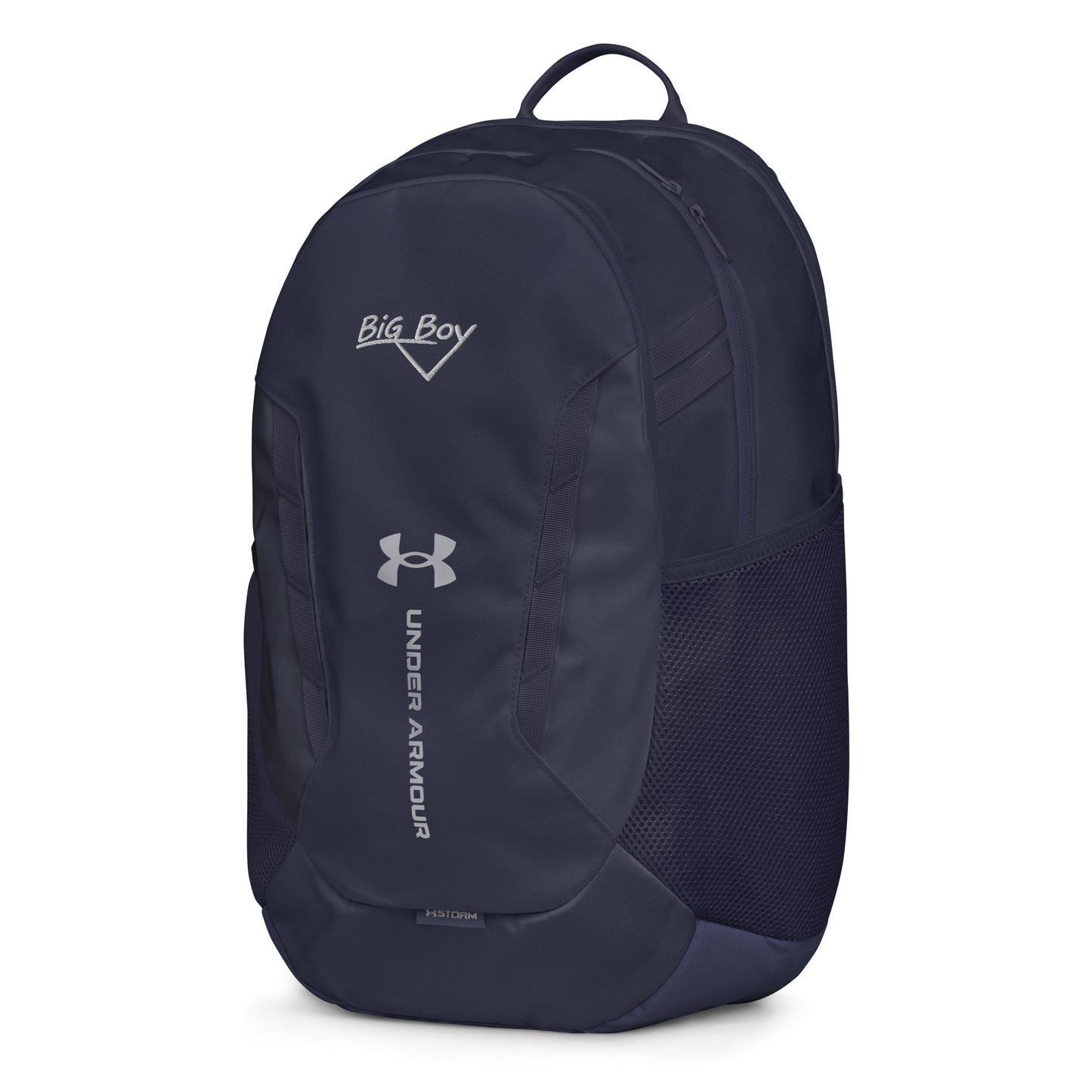 Navy Under Armour backpack featuring the classic white chalk-style "Big Boy" script logo on the top front panel. A silver Under Armour logo is centered above the vertical text "UNDER ARMOUR". The bottom of the bag features the UA Storm technology badge.
