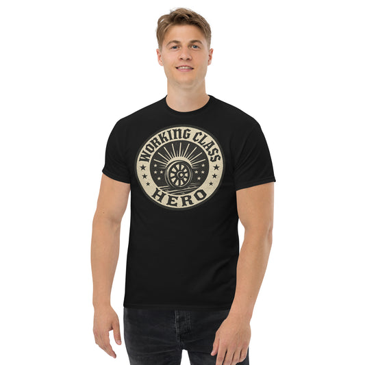 Man wearing a black t-shirt with 'Working Class Hero' graphic design on a white background