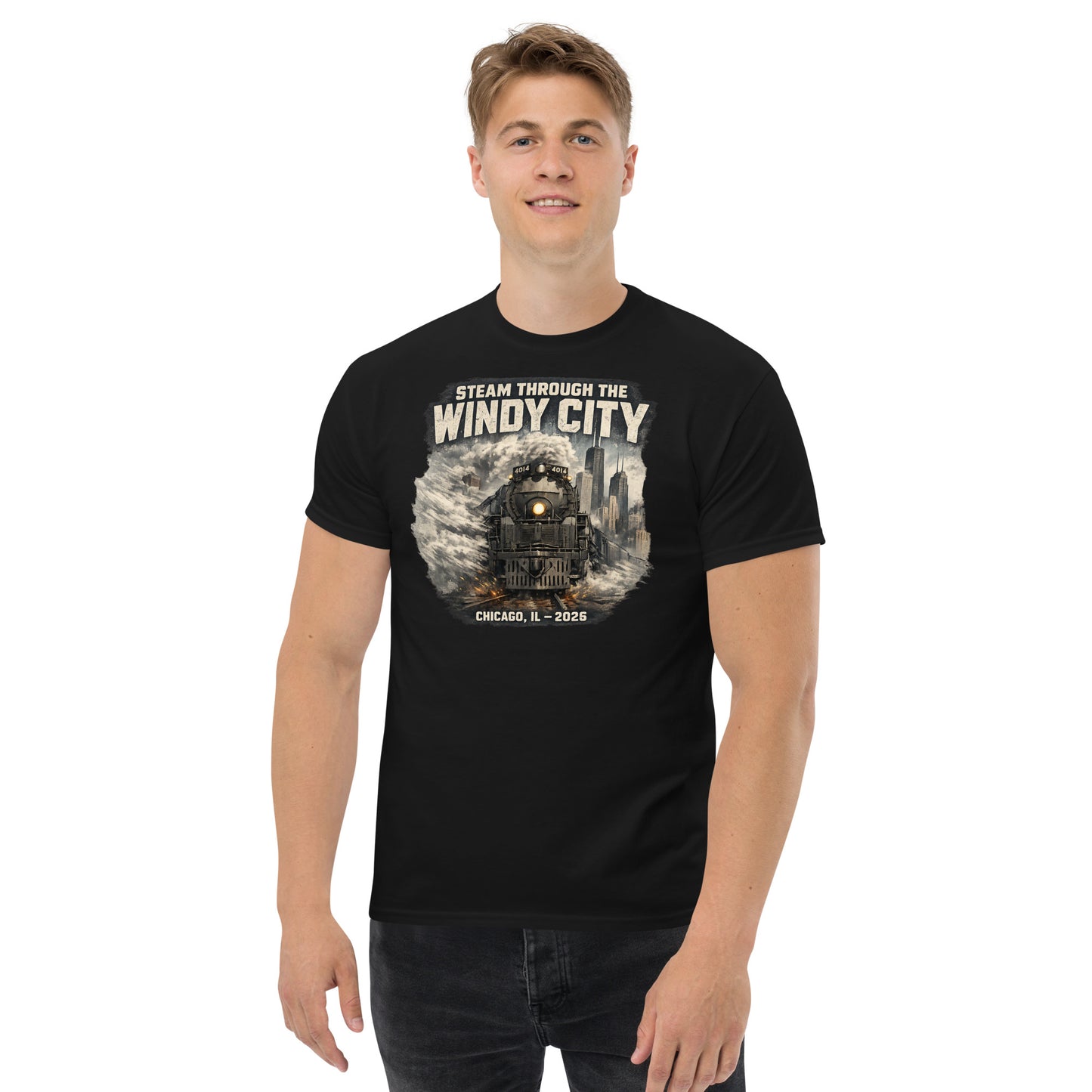 Black t-shirt featuring a graphic of a steam locomotive emerging from smoke in front of a city skyline, with text reading "STEAM THROUGH THE WINDY CITY" at the top and "CHICAGO, IL - 2026" at the bottom.