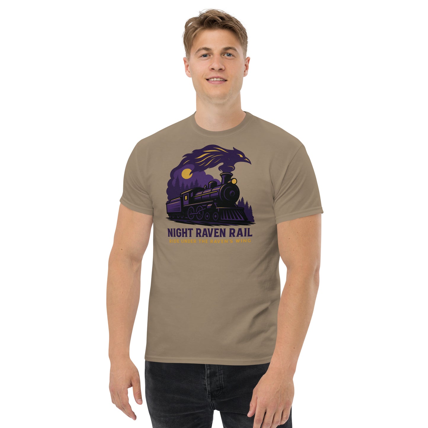 Man wearing a brown t-shirt with a graphic design of a train and raven, text 'Night Raven Rail' on a white background.