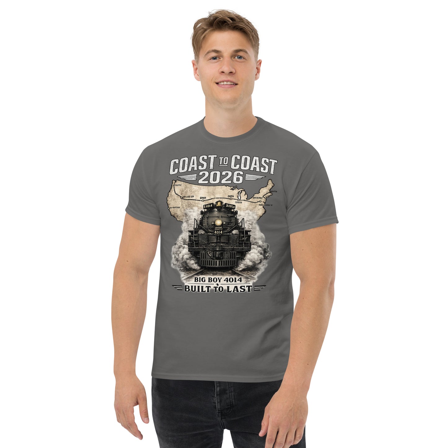 Gray t-shirt featuring a head-on graphic of the Big Boy 4014 steam locomotive emerging from a vintage US map showing a cross-country route, with text reading "Coast to Coast 2026" and "Built To Last".