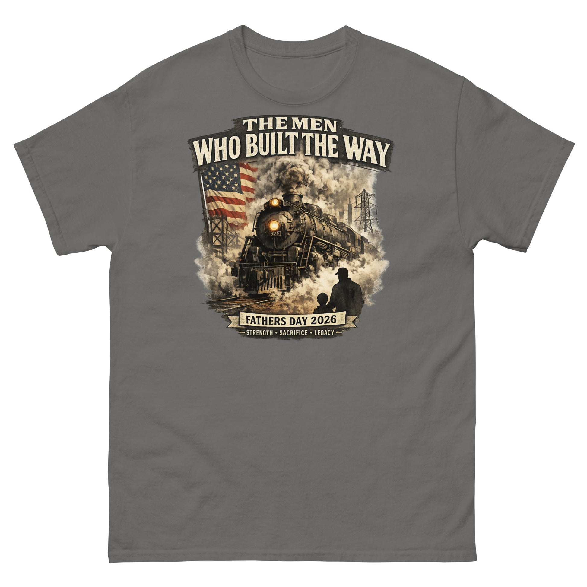 Gray t-shirt featuring a cinematic graphic of a steam locomotive, an American flag, and a silhouette of a father and child holding hands, with text reading "The Men Who Built The Way", "Fathers Day 2026", and "Strength - Sacrifice - Legacy".