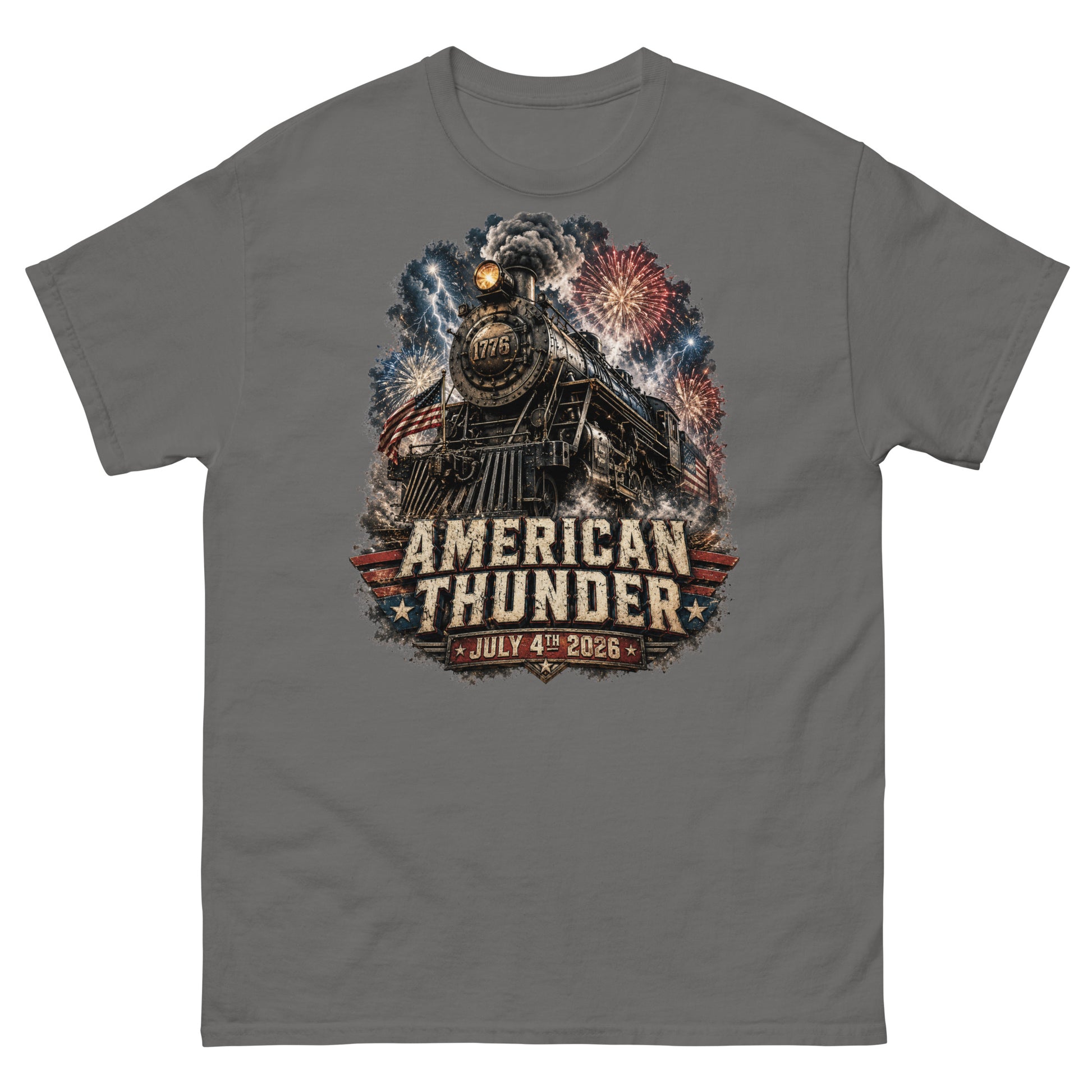 Gray t-shirt featuring a 1776 steam locomotive charging through smoke and patriotic fireworks, with an American flag and distressed text reading "AMERICAN THUNDER" over a red, white, and blue banner, followed by "JULY 4TH 2026".
