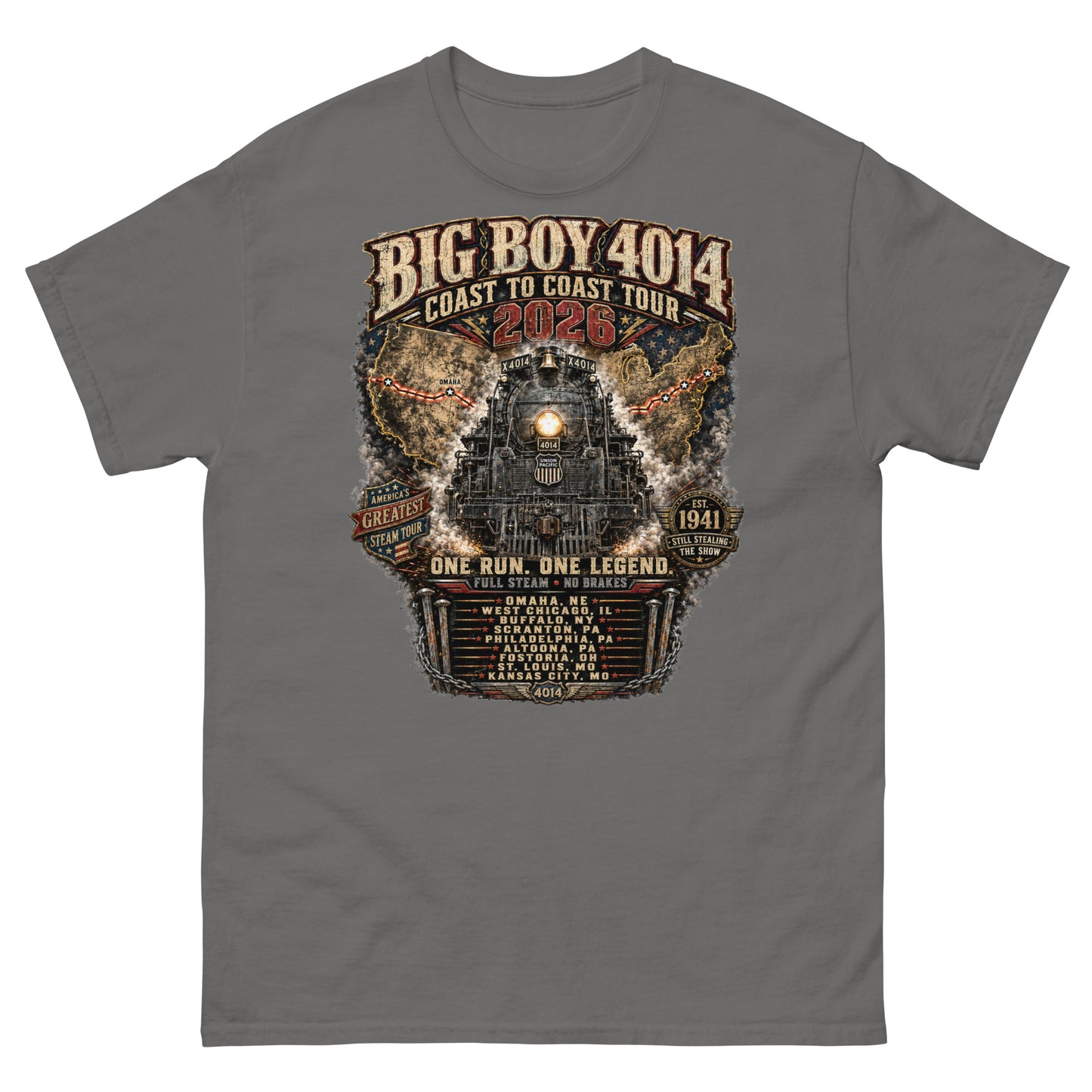 Gray t-shirt featuring a highly detailed, industrial graphic of the Big Boy 4014 steam locomotive backed by a US map, with text reading "BIG BOY 4014 COAST TO COAST TOUR 2026", "ONE RUN. ONE LEGEND.", and a roster of tour stops from Omaha to Kansas City surrounded by metal spikes and chains.