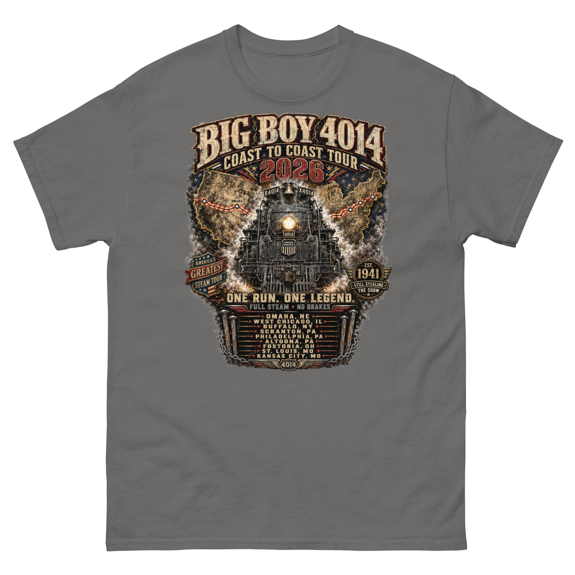 Gray t-shirt featuring a highly detailed, industrial graphic of the Big Boy 4014 steam locomotive backed by a US map, with text reading "BIG BOY 4014 COAST TO COAST TOUR 2026", "ONE RUN. ONE LEGEND.", and a roster of tour stops from Omaha to Kansas City surrounded by metal spikes and chains.