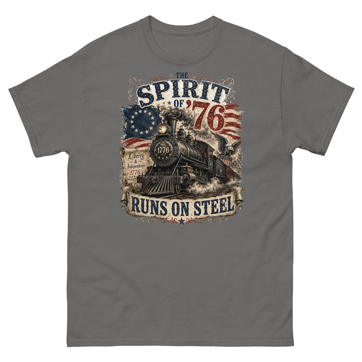 Gray t-shirt featuring a highly detailed vintage graphic. At the top, distressed text reads "THE SPIRIT OF '76". The center shows a classic steam locomotive with "1776" on the front plate, bursting from a 13-star Betsy Ross American flag. A bald eagle flies on the right, and a parchment scroll on the left reads "Liberty & Independence 1776". A banner at the bottom reads "RUNS ON STEEL".