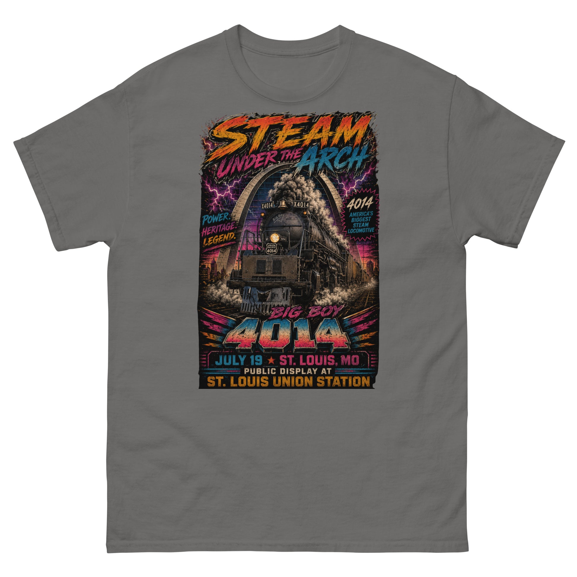 Gray t-shirt featuring a bright, 1980s retro-neon graphic. The Big Boy 4014 steam locomotive is charging forward under the St. Louis Gateway Arch with electric pink lightning in the background. Bold neon text reads "STEAM UNDER THE ARCH", "BIG BOY 4014", "JULY 19 - ST. LOUIS, MO", and "PUBLIC DISPLAY AT ST. LOUIS UNION STATION". Side text badges read "POWER. HERITAGE. LEGEND." and "4014 AMERICA'S BIGGEST STEAM LOCOMOTIVE".