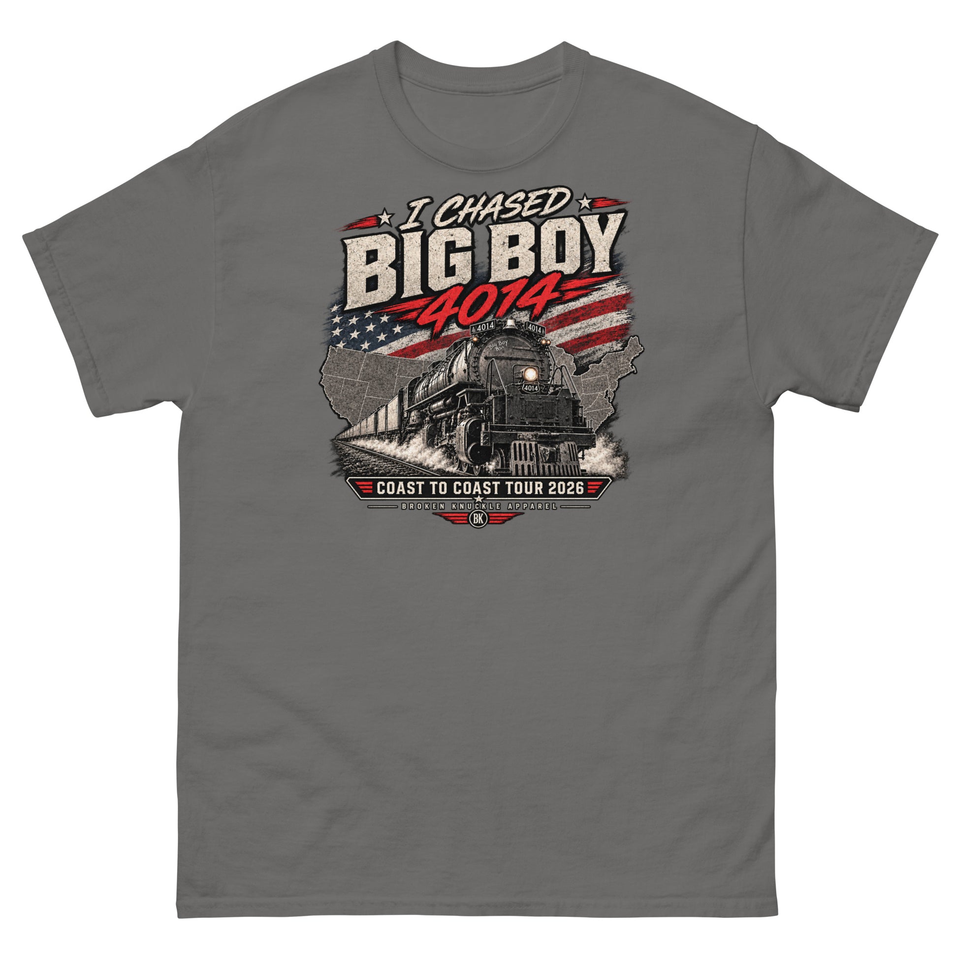 Charcoal classic t-shirt featuring a graphic of the Big Boy 4014 steam locomotive charging out of a USA map filled with the American flag. Distressed text reads "I CHASED BIG BOY 4014" at the top and "COAST TO COAST TOUR 2026" on a banner at the bottom above the Broken Knuckle Apparel logo.