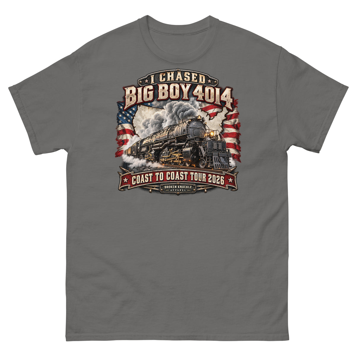 Charcoal classic t-shirt featuring a graphic of the Big Boy 4014 steam locomotive charging forward under a plume of smoke. The background features a distressed white USA map and waving American flags. Vintage text reads "I CHASED BIG BOY 4014" at the top and "COAST TO COAST TOUR 2026" on a red banner at the bottom above the Broken Knuckle Apparel logo.   