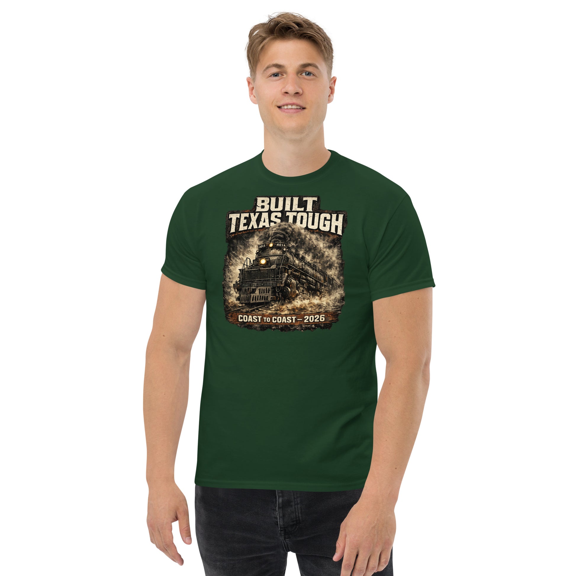 Forest green t-shirt featuring a gritty, cinematic graphic of the Big Boy 4014 steam locomotive emerging from thick smoke with text reading "Built Texas Tough" and "Coast to Coast - 2026".