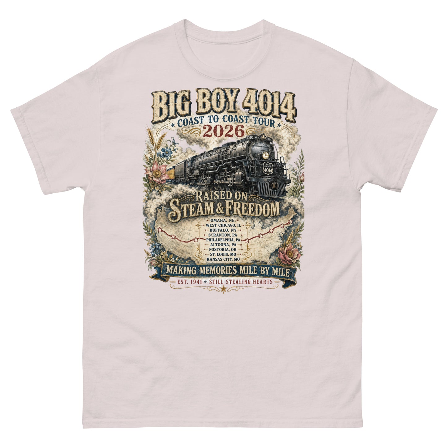 Ice gray t-shirt featuring a vintage graphic of the Big Boy 4014 steam locomotive. The train is surrounded by steam, classic floral designs, and a route map. Text reads "BIG BOY 4014", "COAST TO COAST TOUR 2026", and "RAISED ON STEAM & FREEDOM". Below is a roster of nine tour stops, anchored by banners reading "MAKING MEMORIES MILE BY MILE" and "EST. 1941 STILL STEALING HEARTS".
